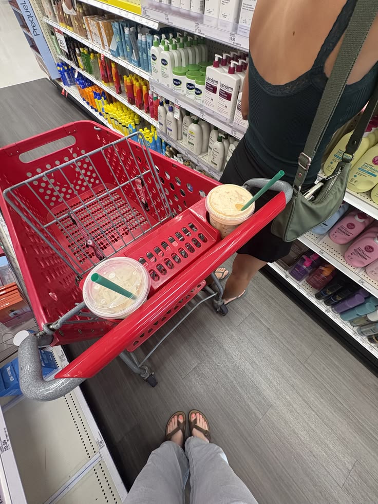 Red shopping cart in a personal care aisle